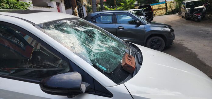 Broken car inside Sector-51 C-Block after masked miscreants forced entry, leaving residents in fear. Broken car inside Sector-51 C-Block after masked miscreants forced entry, leaving residents in fear.