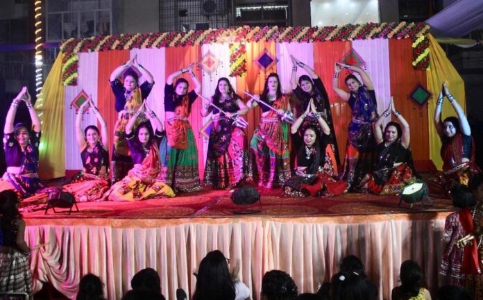 Devotees immersed in the Sundarkand recital during Ashtami at Samriddhi Grand Avenue, Techzone-4.