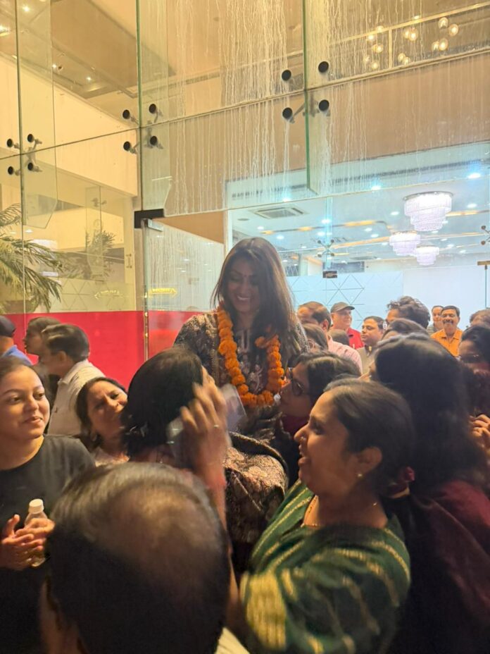 Winning candidates share joyful moments with residents during celebrations.