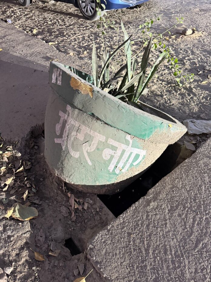 Neglected beautification: Pots meant for city greenery now lying in drains in Greater Noida. Neglected beautification: Pots meant for city greenery now lying in drains in Greater Noida.