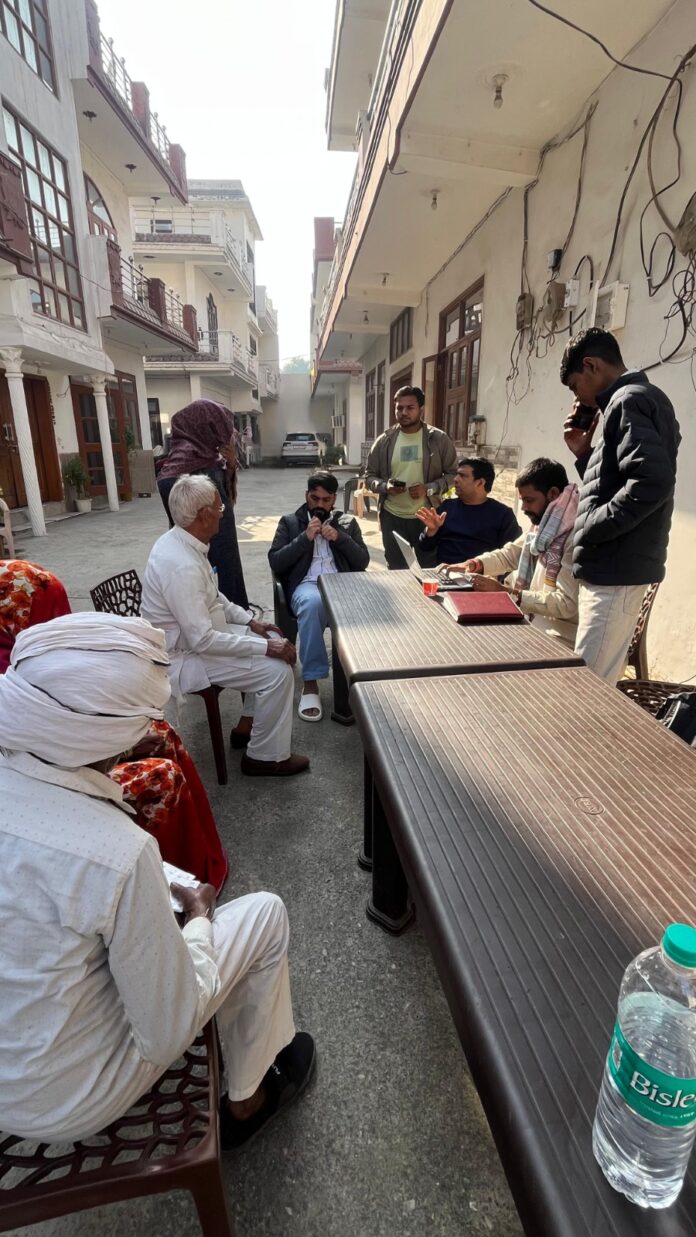 Dr. Ranjan Tomar and Sachin Gupta interacting with beneficiaries during the Ayushman health camp. Dr. Ranjan Tomar and Sachin Gupta interacting with beneficiaries during the Ayushman health camp.