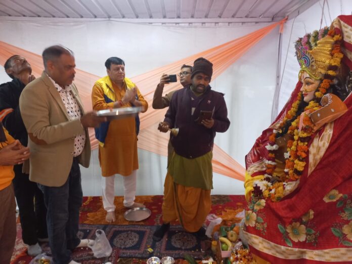 Residents of Shri Radha Sky Garden offer prayers to Goddess Saraswati during Basant Panchami celebrations in Greater Noida.