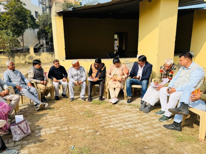 Members of RWA Beta 1 Greater Noida during the monthly review meeting held on January 24 2026 to discuss security cleanliness and Republic Day initiatives