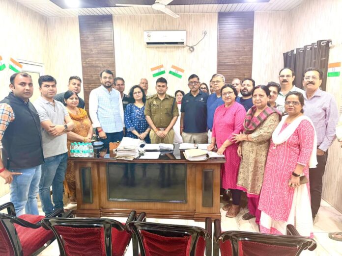 Residents of Shri Radha Sky Garden submit a signed memorandum to police authorities highlighting serious security lapses within the society premises.