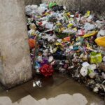 Garbage piles and incomplete infrastructure at VictoryOne Central highlight worsening living conditions, as residents demand urgent action from authorities.