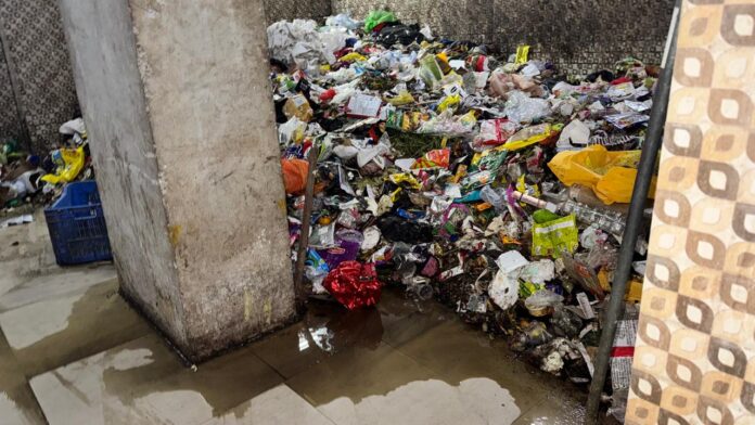 Garbage piles and incomplete infrastructure at VictoryOne Central highlight worsening living conditions, as residents demand urgent action from authorities.