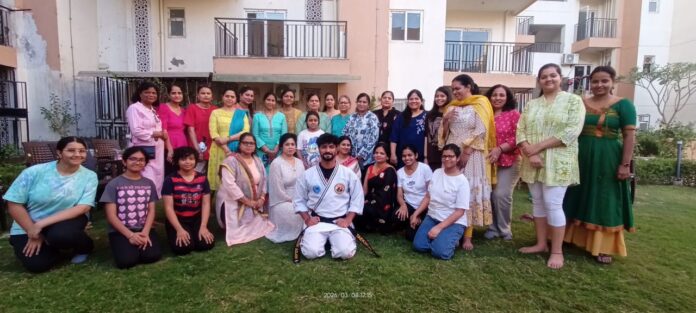 Women residents participate in a self-defense training session organized by AOA at Centurion Park Terrace Homes, Greater Noida West on International Women’s Day.