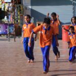 Employees of NEC Corporation India engage with children at Amarpushp Educational and Welfare Society during a lively session of poetry, games and career guidance in Greater Noida West.