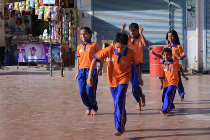 Employees of NEC Corporation India engage with children at Amarpushp Educational and Welfare Society during a lively session of poetry, games and career guidance in Greater Noida West. Employees of NEC Corporation India engage with children at Amarpushp Educational and Welfare Society during a lively session of poetry, games and career guidance in Greater Noida West.