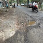 Crater-filled road in Beta-1 leaves commuters at risk, residents allege authority negligence