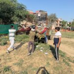 Residents protest against repeated night-time garbage dumping near House A-72 in Sector Beta 1, demand strict fines and immediate action.