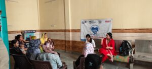 Radio Amity 107.8 FM and SMART Project teams interact with residents during a health awareness meeting in Barola, spreading information on vaccination and government healthcare schemes.