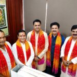 Dinesh Mishra being felicitated after his appointment as District President of Brahmin Samaj Mahasangh, Gautam Buddh Nagar, in the presence of organization officials and dignitaries in Greater Noida.