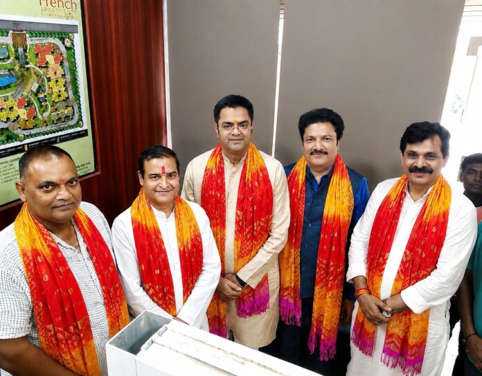 Dinesh Mishra being felicitated after his appointment as District President of Brahmin Samaj Mahasangh, Gautam Buddh Nagar, in the presence of organization officials and dignitaries in Greater Noida.