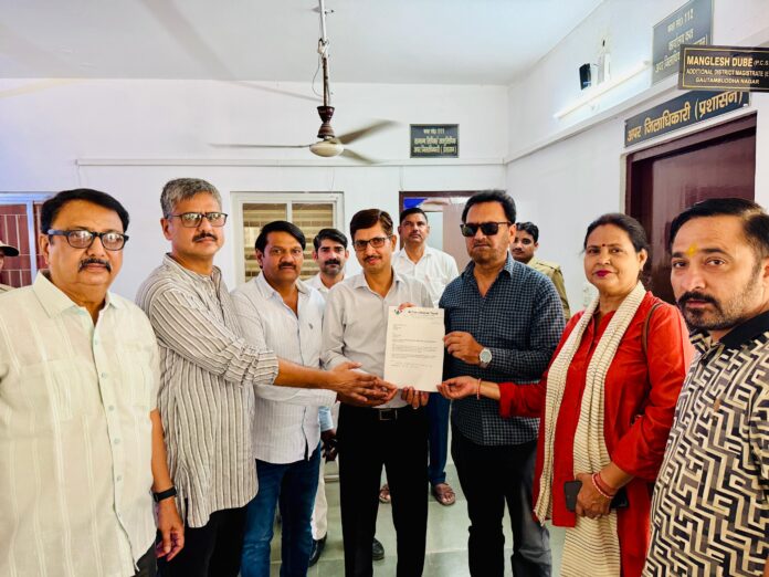 Residents and social activists submit a memorandum at the District Collectorate demanding government hospitals in Noida instead of more private healthcare projects.