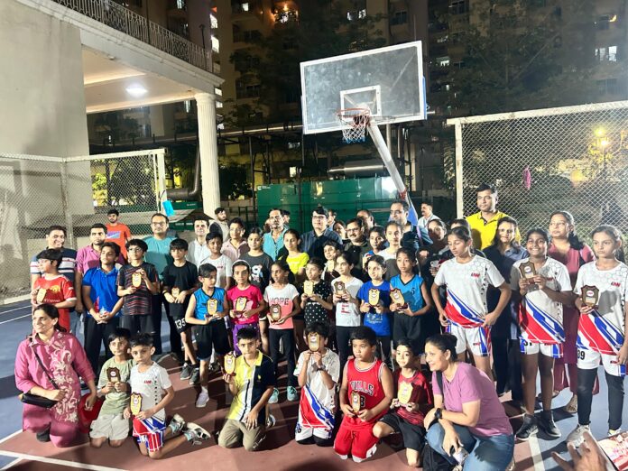Young basketball players in action during the grand tournament at Mahagun Mirabella Society.