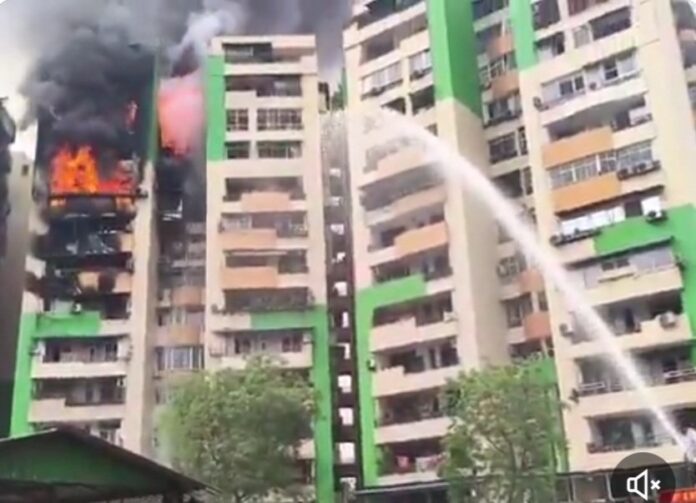 Massive fire breaks out at Gaur Green Avenue Society in Indirapuram, Ghaziabad. Residents rescued amid thick smoke and chaos as multiple flats suffer severe damage.