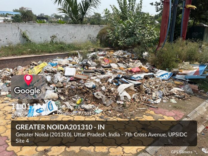 Garbage heaps and overgrown bushes surrounding the Ramlila Ground in UPSIDA Site-4, Greater Noida, have prompted Active Citizen Team member Harendra Bhati to demand immediate cleaning and regular maintenance from the authorities.