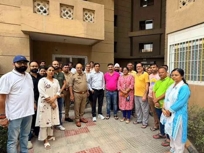 Newly elected Sampurnam Apartment Owners Association (SAOA) office-bearers and executive committee members receive election certificates after the 2026-27 election concluded unopposed at Eros Sampurnam, Greater Noida West.