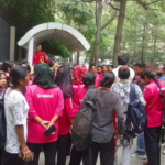 Domestic workers gather outside a residential society in Greater Noida West to protest an alleged assault on a fellow worker, highlighting concerns over safety and dignity in the domestic services sector.