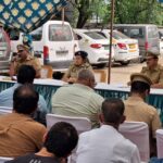 ACP-1 Central Noida Diksha Singh addresses residents, DJ operators and Kanwar camp organisers during a peace committee meeting at Phase-3 Police Station ahead of the Kanwar Yatra, stressing safety, traffic management and adherence to guidelines.