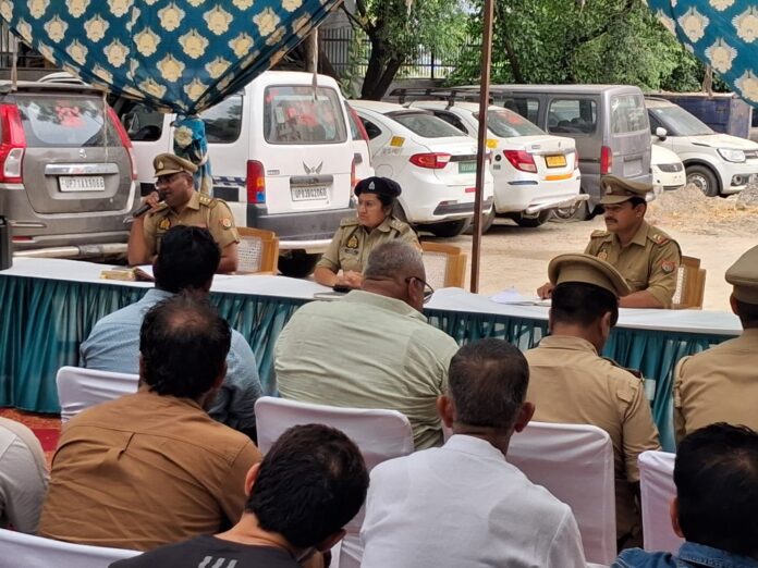 ACP-1 Central Noida Diksha Singh addresses residents, DJ operators and Kanwar camp organisers during a peace committee meeting at Phase-3 Police Station ahead of the Kanwar Yatra, stressing safety, traffic management and adherence to guidelines.