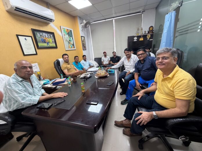 Gautam Buddh Nagar Hockey Association members hold a meeting to discuss preparations for Sports Day on the birth anniversary of hockey legend Major Dhyan Chand and plans to promote sports among young players.