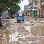 Damaged stretches of the road and waterlogging in Knowledge Park 3 have raised concerns over road quality, drainage and civic maintenance.