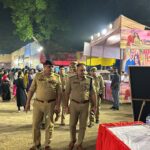 Gautam Buddh Nagar Police personnel inspect a Durga Puja pandal under Sector 20 police station limits in Noida to review security arrangements and crowd management.