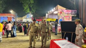 Gautam Buddh Nagar Police personnel inspect a Durga Puja pandal under Sector 20 police station limits in Noida to review security arrangements and crowd management.
