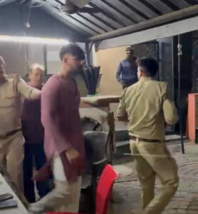 Residents of Amrapali Zodiac, Noida, gather at Sector 113 police station with NHRF and AOA representatives to seek action after a car without a number plate allegedly damaged several vehicles in the society.