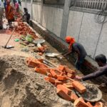 Road and interlocking tile construction at Adarsh Bihar Society in Chi-4, Greater Noida, remains stalled amid a dispute over plant relocation. Police and Greater Noida Authority officials are expected to visit the site on October 19 to assess the situation.