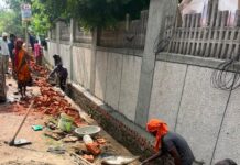 Road and interlocking tile construction at Adarsh Bihar Society in Chi-4, Greater Noida, remains stalled amid a dispute over plant relocation. Police and Greater Noida Authority officials are expected to visit the site on October 19 to assess the situation.