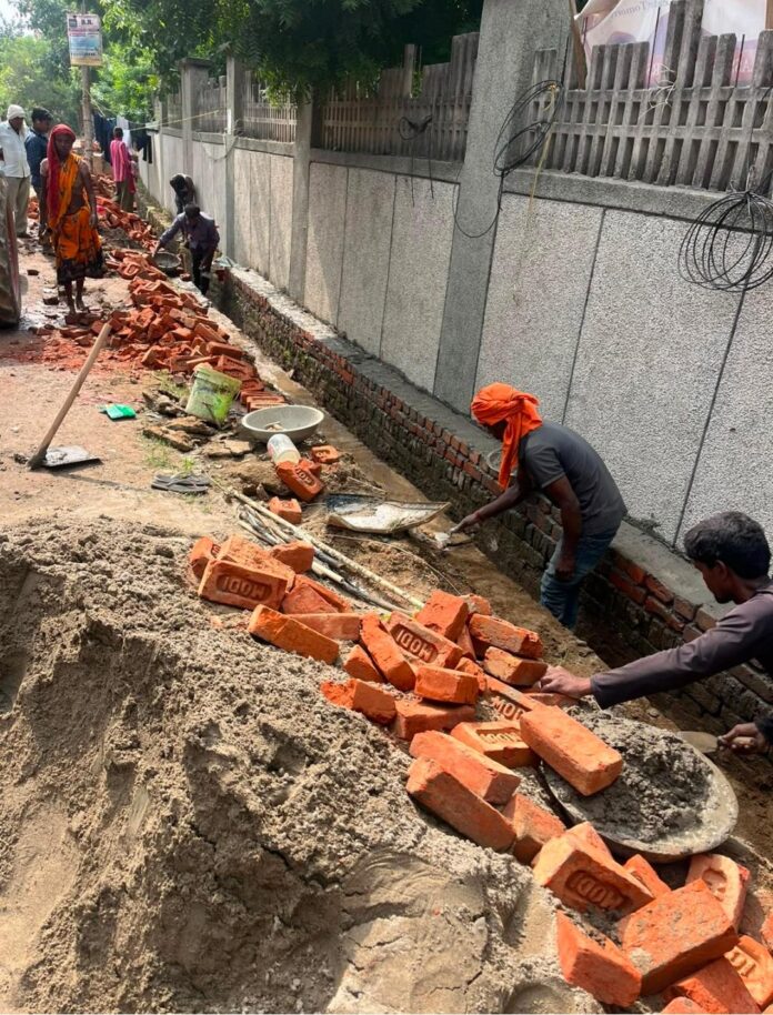 Road and interlocking tile construction at Adarsh Bihar Society in Chi-4, Greater Noida, remains stalled amid a dispute over plant relocation. Police and Greater Noida Authority officials are expected to visit the site on October 19 to assess the situation.