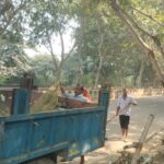 Greater Noida Authority officials begin a cleaning drive outside Adarsh Vihar Society in Sector Chi-4 on October 23, 2026, following repeated complaints from residents.