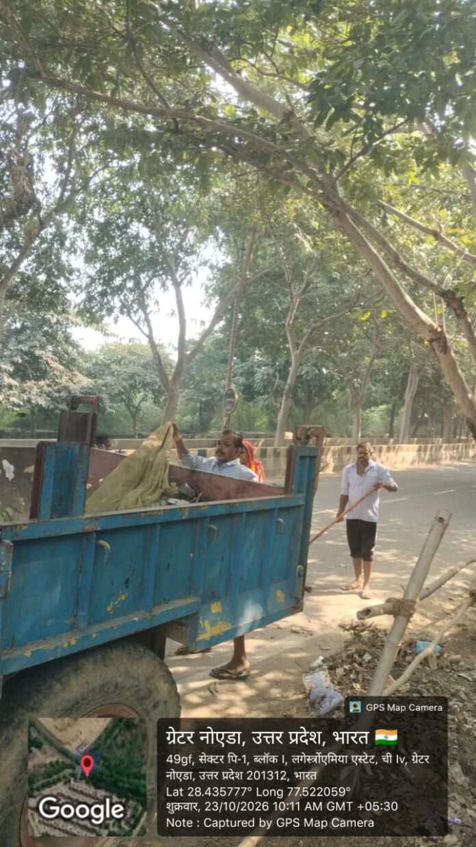 Greater Noida Authority officials begin a cleaning drive outside Adarsh Vihar Society in Sector Chi-4 on October 23, 2026, following repeated complaints from residents. Greater Noida Authority officials begin a cleaning drive outside Adarsh Vihar Society in Sector Chi-4 on October 23, 2026, following repeated complaints from residents.